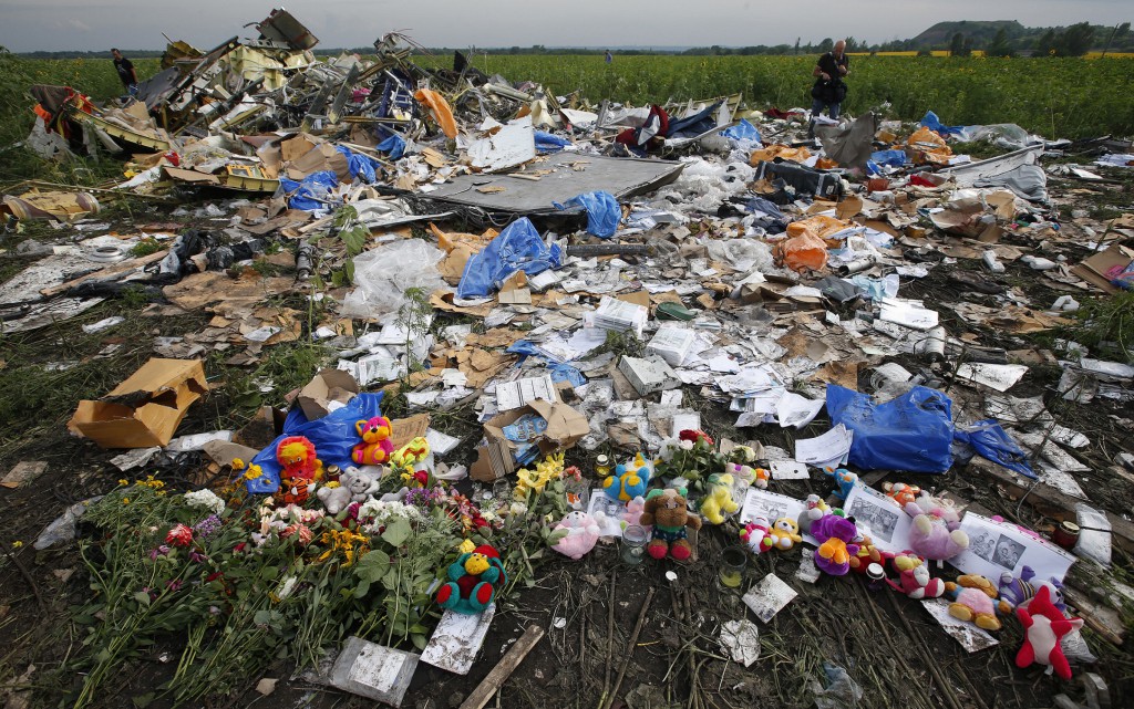 Flowers and mementos placed at the crash site of Malaysia Airlines Flight MH17 are pictured near the settlement of Rozspyne in the Donetsk region