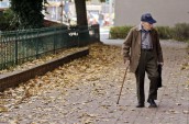 photo-of-elderly-man-walking-on-pavement-3093287